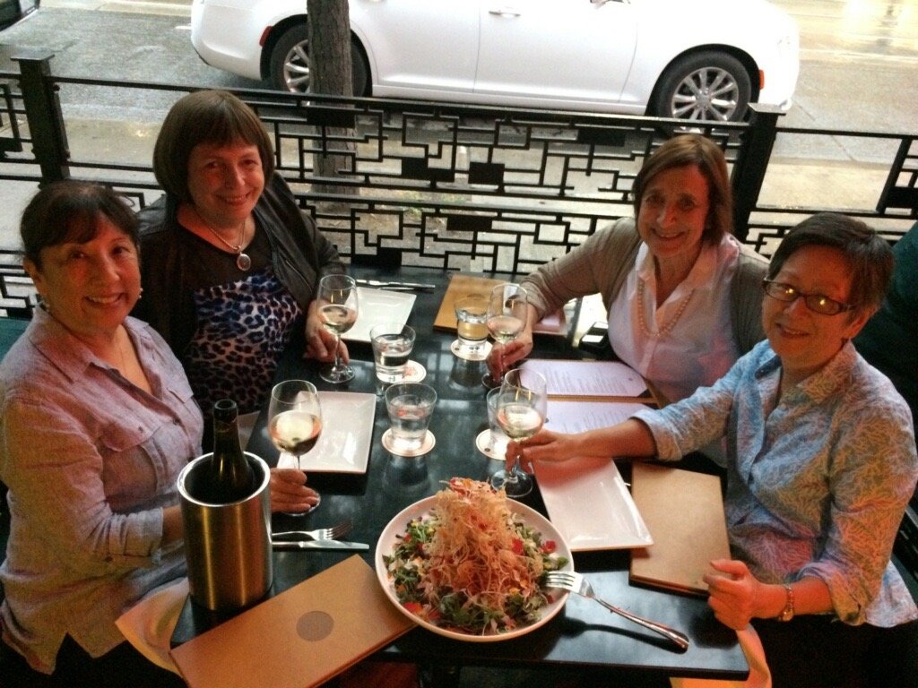 Muriel Stitt eating dinner with three friends from her bridge club